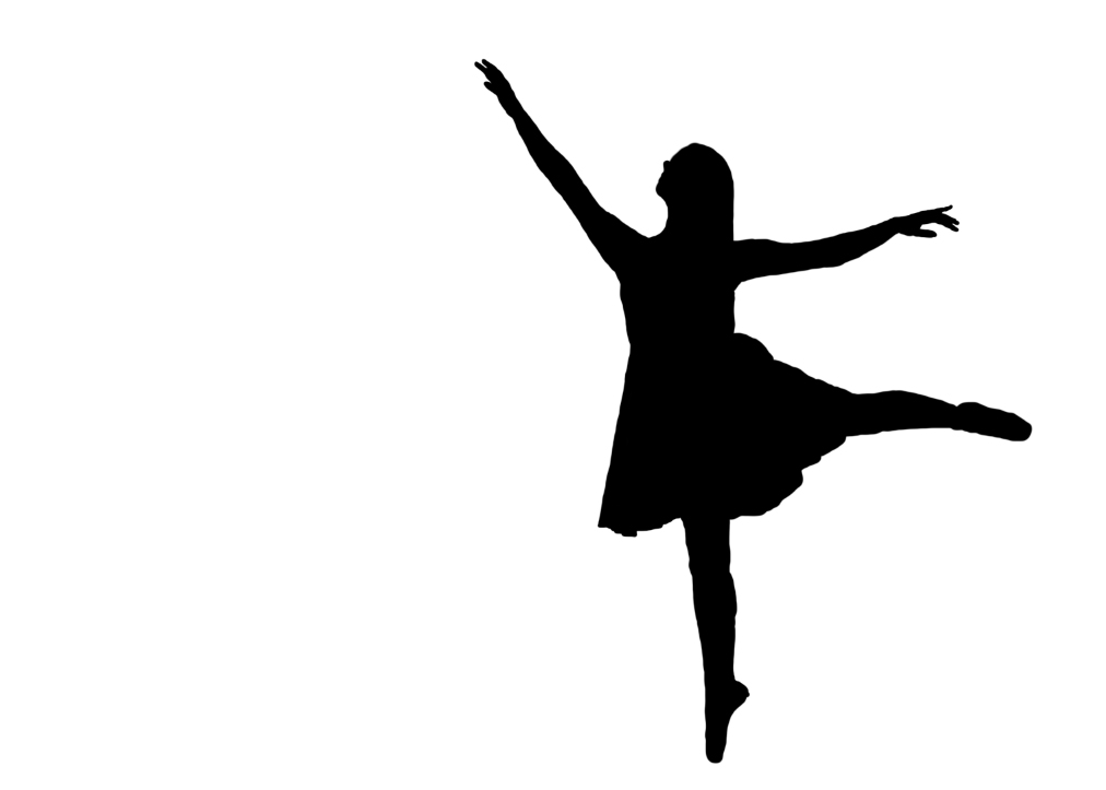 Silhouette of dancer on pointe in arabesque